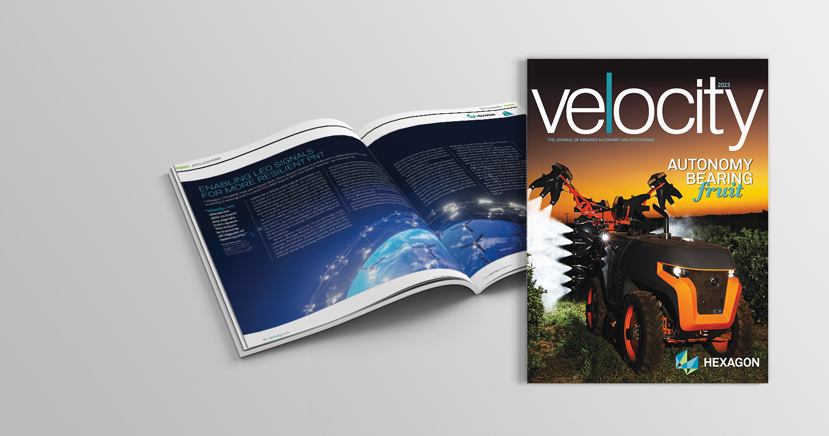 Copy of Velocity 2023 magazine with an another copy open to an article called Enabling LEO Signals for More Resilient PNT